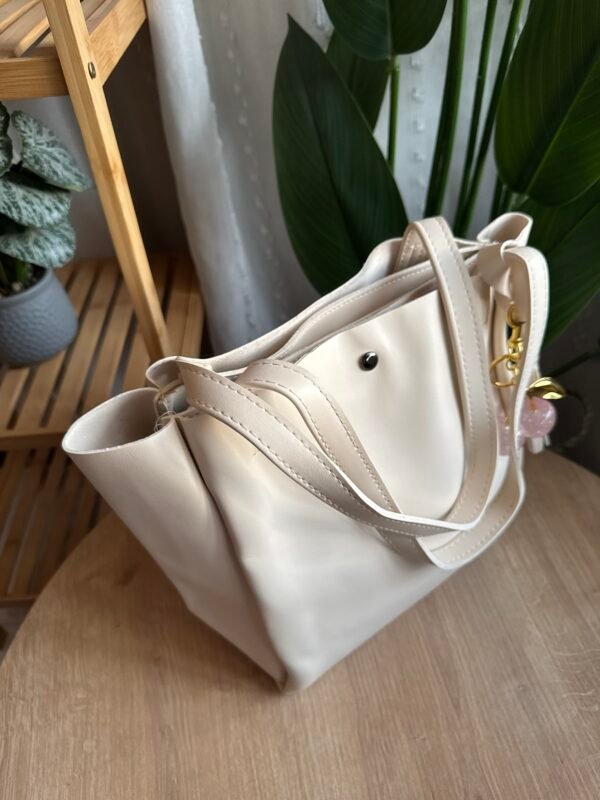 حقيبة ب ٣ خانات لون اوف وايت