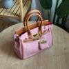 حقيبة لون وردي مطعم بني(مع المداليه)