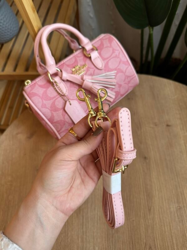 حقيبة coach لون وردي