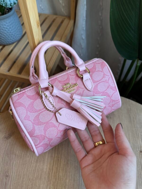 حقيبة coach لون وردي