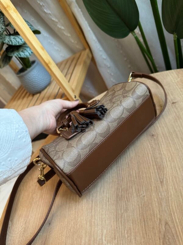 حقيبة coach لون جوزي