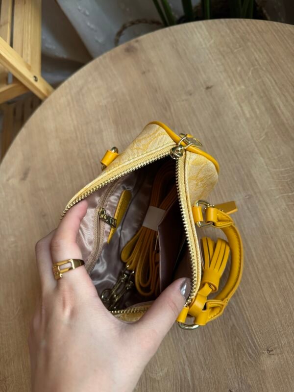 حقيبه coach لون اصفر