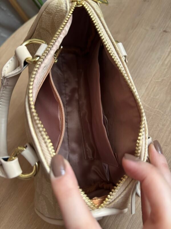 حقيبة coach لون بيجي