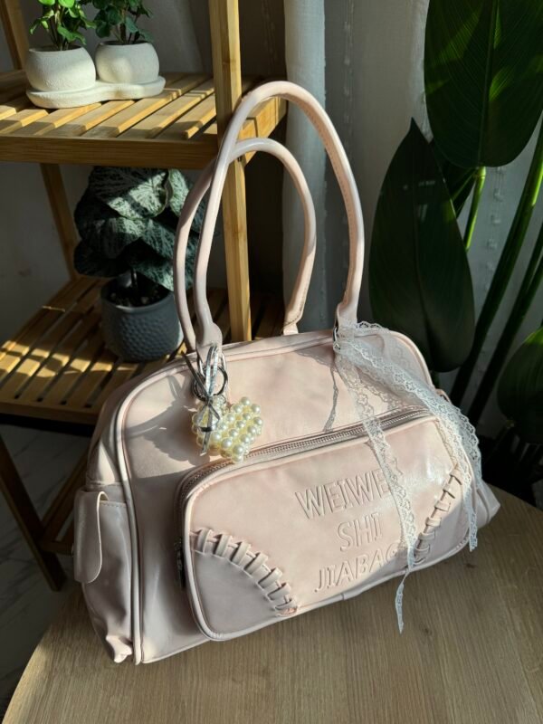 img_9972 حقيبة واسعة لون وردي فاتج (مع المداليات)