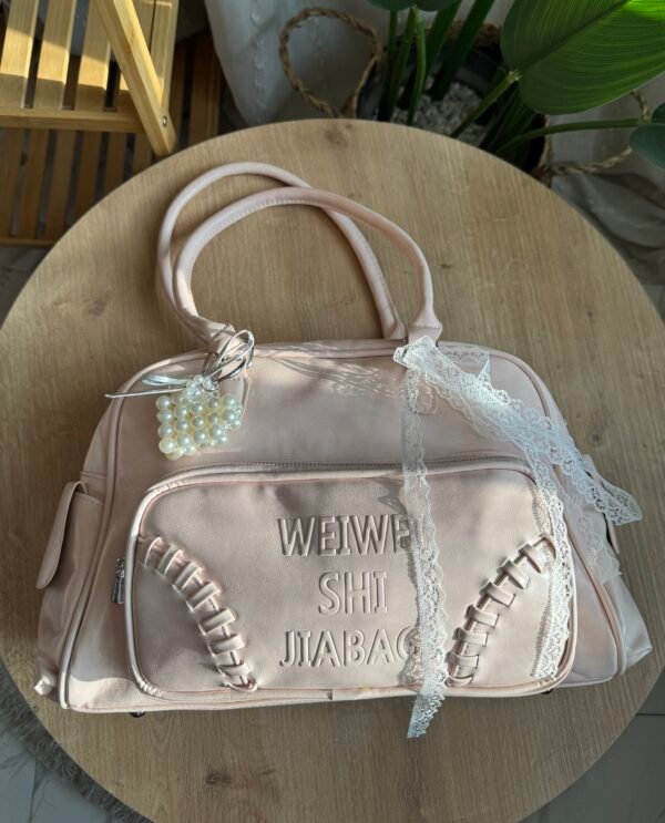 img_9978 حقيبة واسعة لون وردي فاتج (مع المداليات)