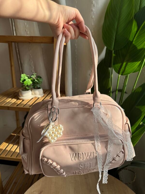 img_9983 حقيبة واسعة لون وردي فاتج (مع المداليات)