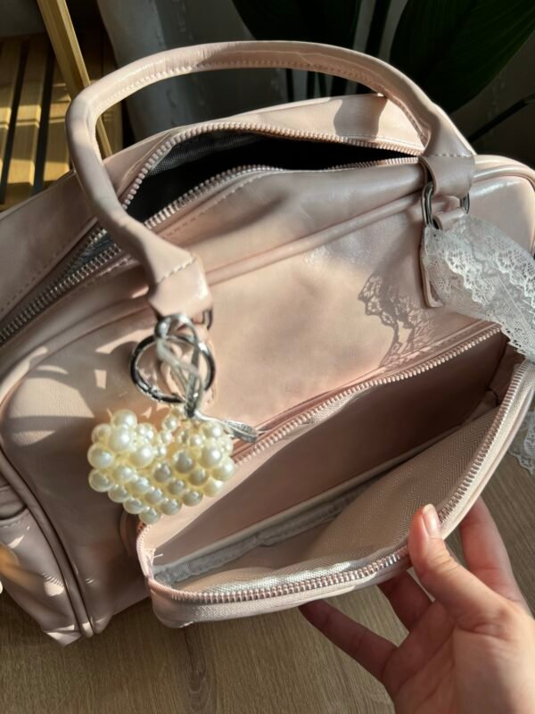 img_9988 حقيبة واسعة لون وردي فاتج (مع المداليات)