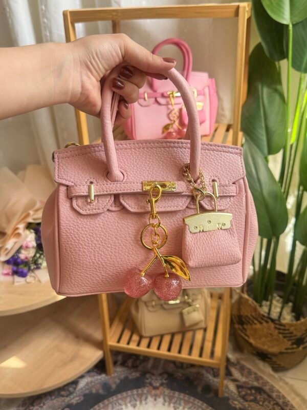 حقيبة هرمز لون وردي