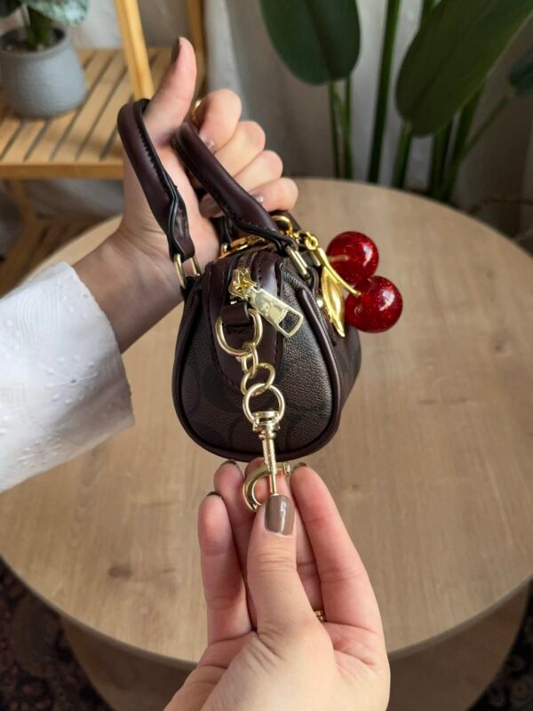 حقيبة coach لون بني (بدون المداليه)