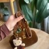 حقيبة مخمل لون جوزي (مع المداليه)